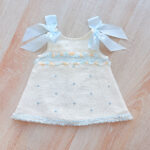 EvaBella A-Line Open Back Dress – White Metallic Tweed Fabric -Blue Embroidery Details – Satin Shoulder Bows – EBSS07 Baby Blue - Image 3